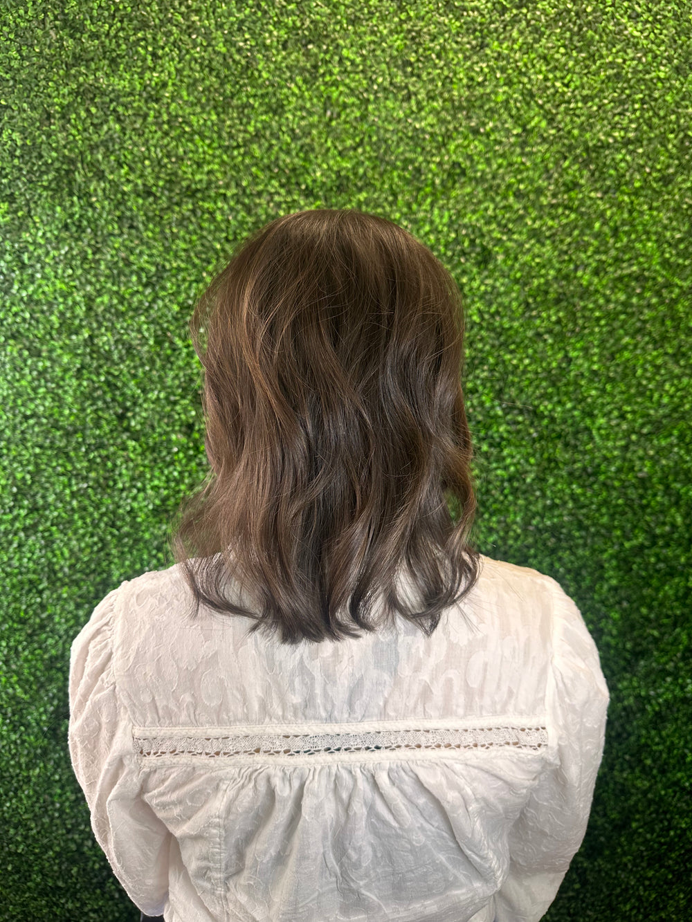 Brunette client back view after Studio Zeal hair enhancement