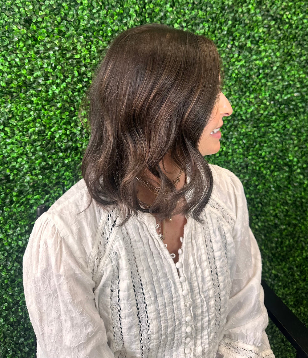 Brunette client side profile after Studio Zeal hair enhancement